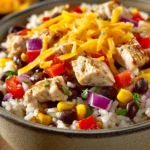 Close-up of a Chicken and Rice Burrito Bowl with fresh ingredients and vibrant colors.