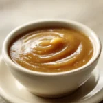 Close-up of chicken with creamy low calorie gravy on a white plate
