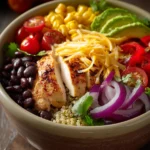 Close-up of a Mexican chicken quinoa bowl with fresh ingredients and vibrant colors