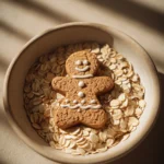 Close-up of oatmeal cookie gingerbread girl with warm lighting and minimal background
