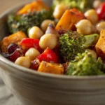 Close-up of roasted chickpeas and vegetables with bright lighting