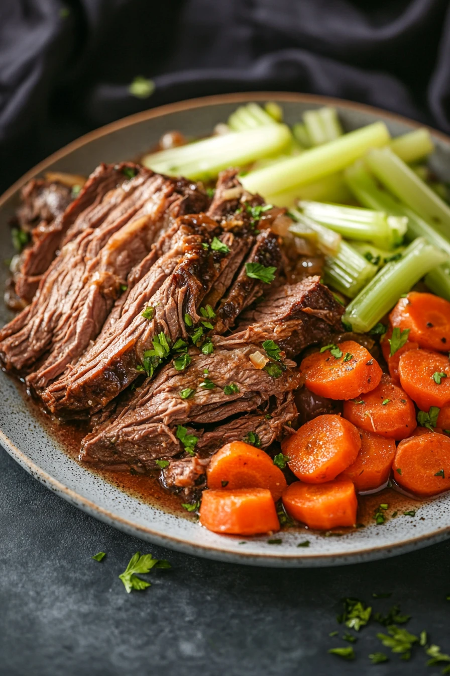 Close-up of slow cooker beef chuck roast with rich textures and natural lighting.