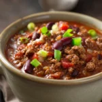 Close-up of a hearty slow cooker chili with beans and spices from Natasha's Kitchen.