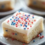 Close-up of sugar cookie bars decorated for 4th of July with red, white, and blue sprinkles.