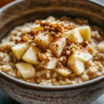 Close-up of apple muffin oatmeal with a warm, inviting presentation.