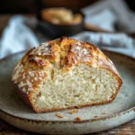 Close-up of freshly baked bread without yeast on a wooden board