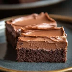 Close-up of sheet cake squares with a clean background and bright lighting.