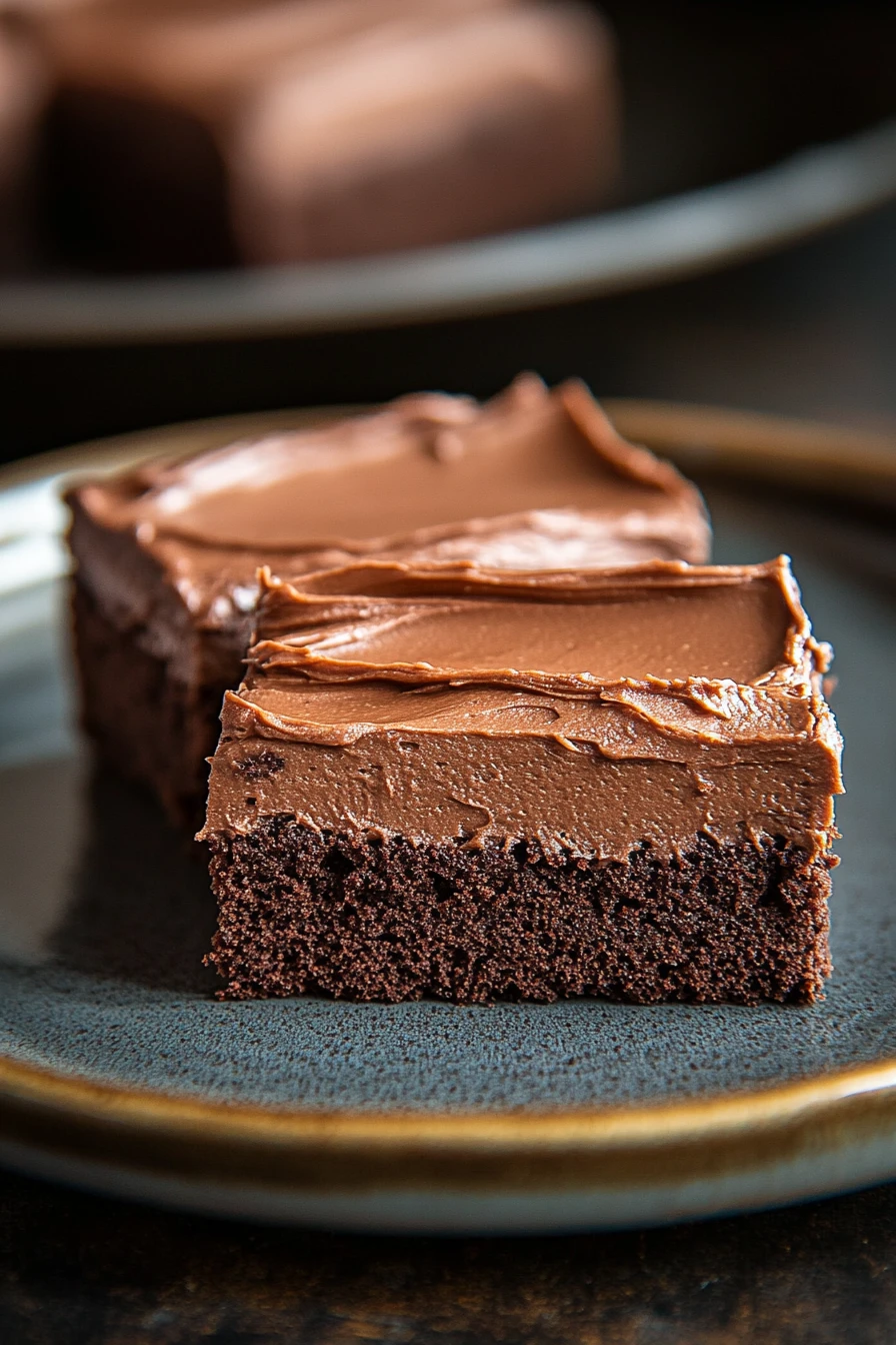 Close-up of sheet cake squares with a clean background and bright lighting.