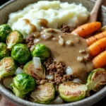 Close-up of a turkey dinner bowl with vegetables and grains, brightly lit and appetizing.