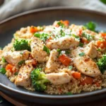 Close-up of a high protein chicken dinner cooked in an instant pot, garnished with herbs.