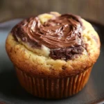 Close-up of a muffin with Nutella and yogurt on a clean background