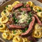 Close-up of one pot garlic parmesan steak and tortellini with creamy sauce