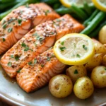 Close-up of a salmon dinner with vegetables, perfect for a family meal.